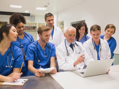 Medical,Students,And,Professor,Using,Laptop,At,The,University Medical,Students,And,Professor,Using,Laptop,At,The,University